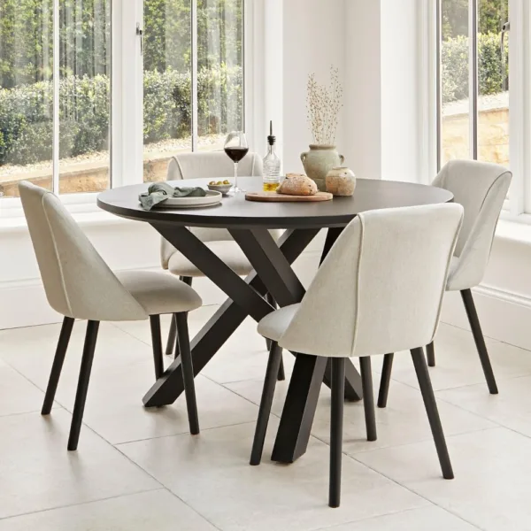 Levi Black Round Dining Table Set - 4 Seater - Freya Sand Dining Chairs - Black Oak legs